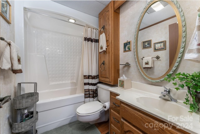 full bathroom with vanity, toilet, shower / bathtub combination with curtain, and a textured ceiling