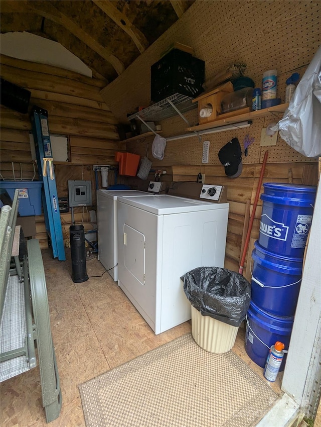 clothes washing area with independent washer and dryer