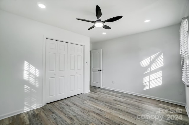 unfurnished bedroom featuring a closet, ceiling fan, and light hardwood / wood-style floors