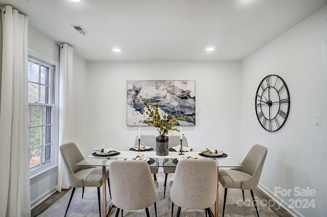 dining area with hardwood / wood-style flooring