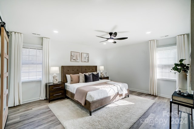 bedroom featuring ceiling fan and light wood-type flooring