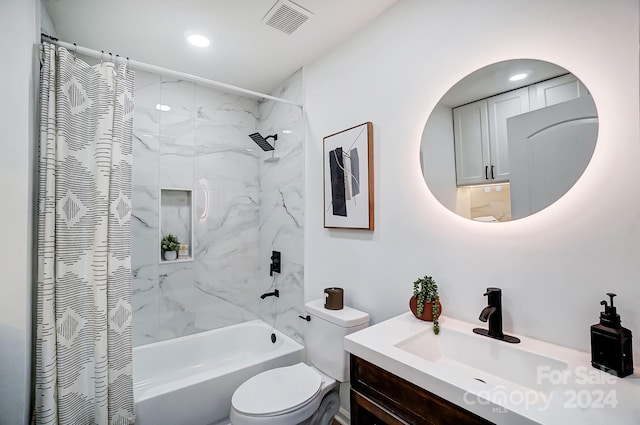 full bathroom with shower / bath combination with curtain, vanity, and toilet