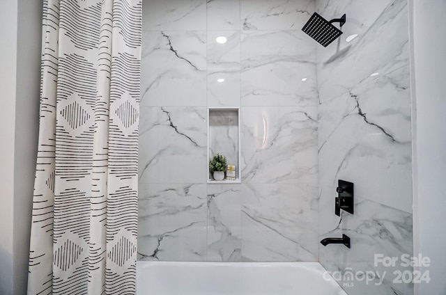 bathroom featuring shower / bath combination with curtain