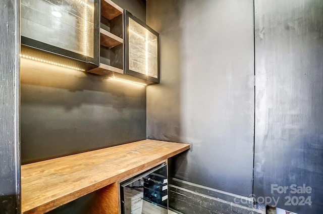 kitchen with wine cooler and butcher block counters