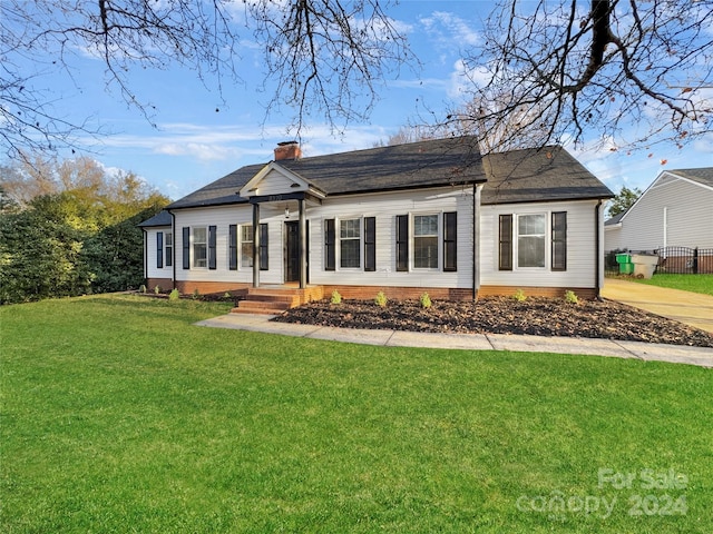 ranch-style house with a front yard