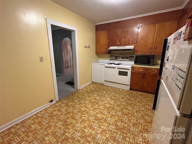 kitchen with electric range, crown molding, and white fridge