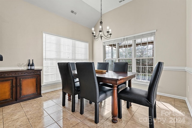 tiled dining room featuring a chandelier, high vaulted ceiling, and a healthy amount of sunlight