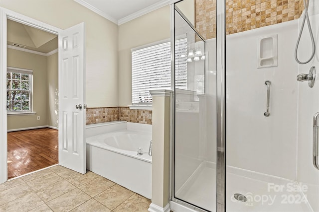 bathroom featuring wood-type flooring, shower with separate bathtub, and crown molding