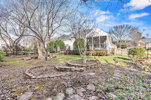 view of yard featuring a sunroom