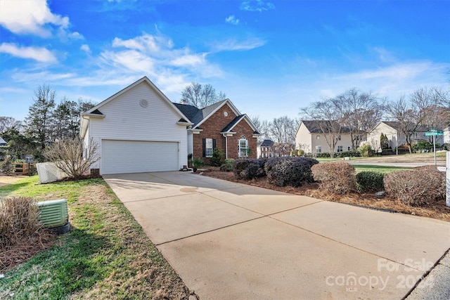 view of front of property with central AC and a garage