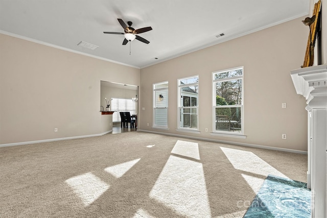 unfurnished living room with ceiling fan, ornamental molding, and carpet flooring