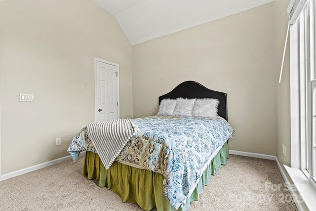 carpeted bedroom featuring lofted ceiling