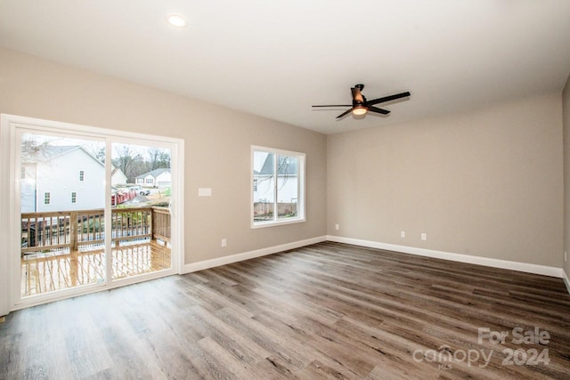 unfurnished living room featuring ceiling fan, a healthy amount of sunlight, and hardwood / wood-style flooring