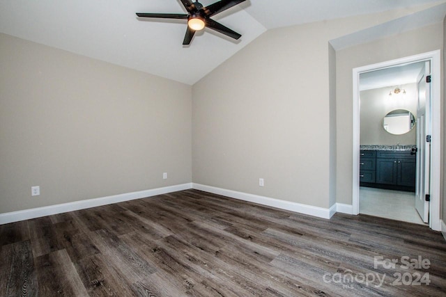 interior space featuring ceiling fan, dark hardwood / wood-style flooring, and vaulted ceiling