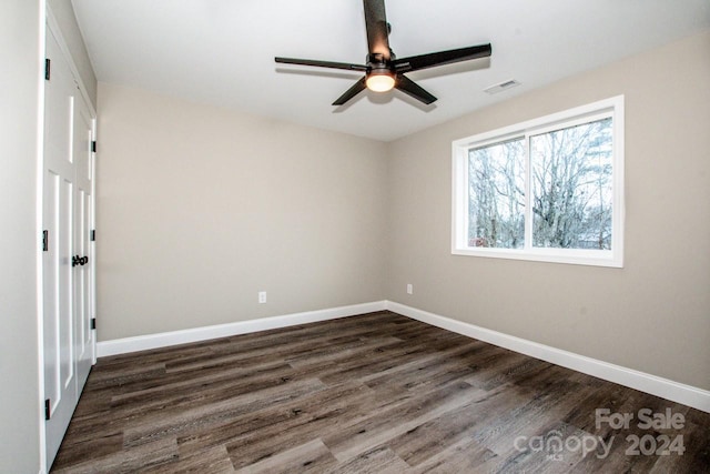 unfurnished bedroom featuring dark hardwood / wood-style floors and ceiling fan