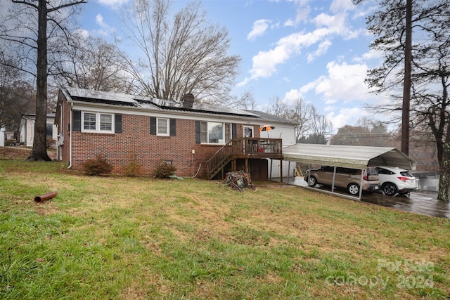 view of front of house with a wooden deck and a front yard