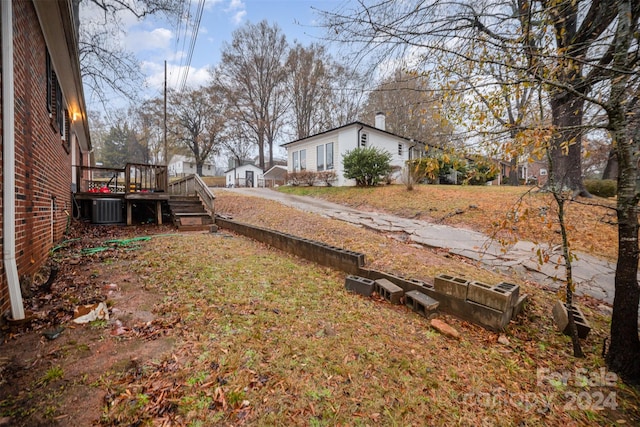 view of yard with a wooden deck