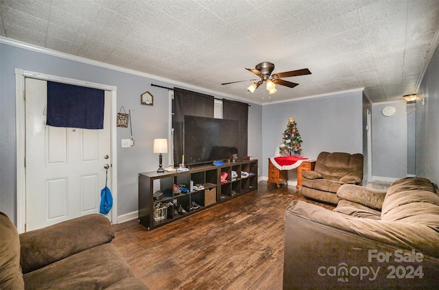 living room featuring hardwood / wood-style flooring, ceiling fan, and ornamental molding