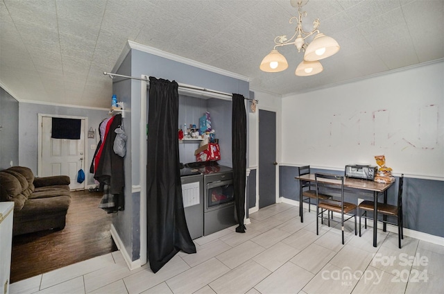 kitchen with hardwood / wood-style floors, ornamental molding, and a notable chandelier