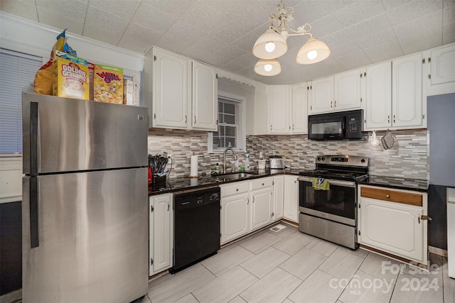 kitchen with black appliances, decorative backsplash, white cabinets, and sink