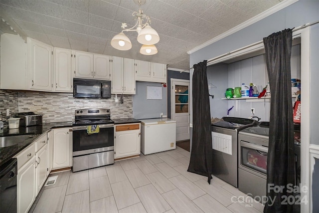 kitchen featuring black appliances, white cabinets, ornamental molding, and washer / clothes dryer