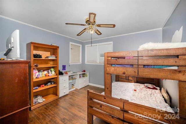 bedroom with crown molding, dark hardwood / wood-style flooring, and ceiling fan