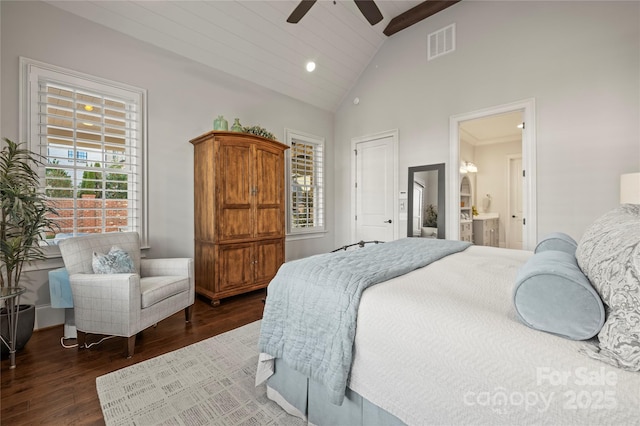 bedroom featuring visible vents, ensuite bathroom, ceiling fan, wood finished floors, and high vaulted ceiling