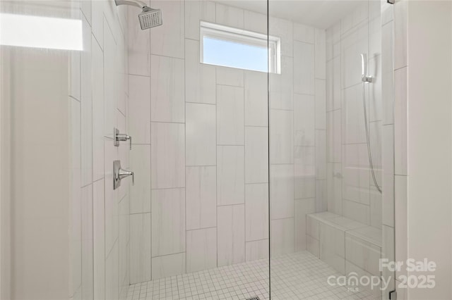 full bath with a tile shower