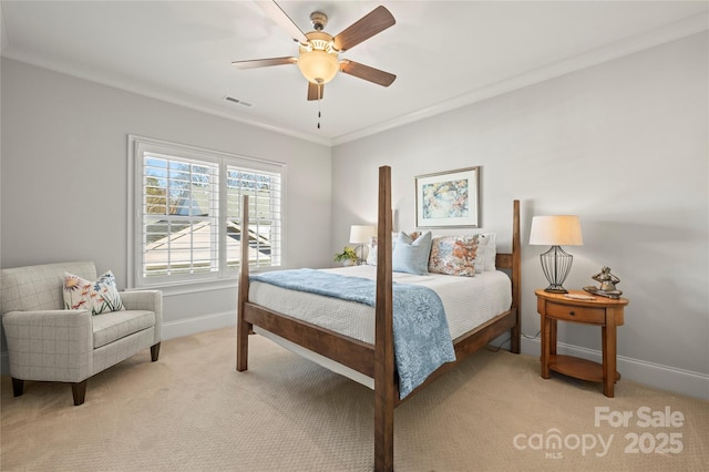 bedroom with light carpet, baseboards, visible vents, ceiling fan, and crown molding