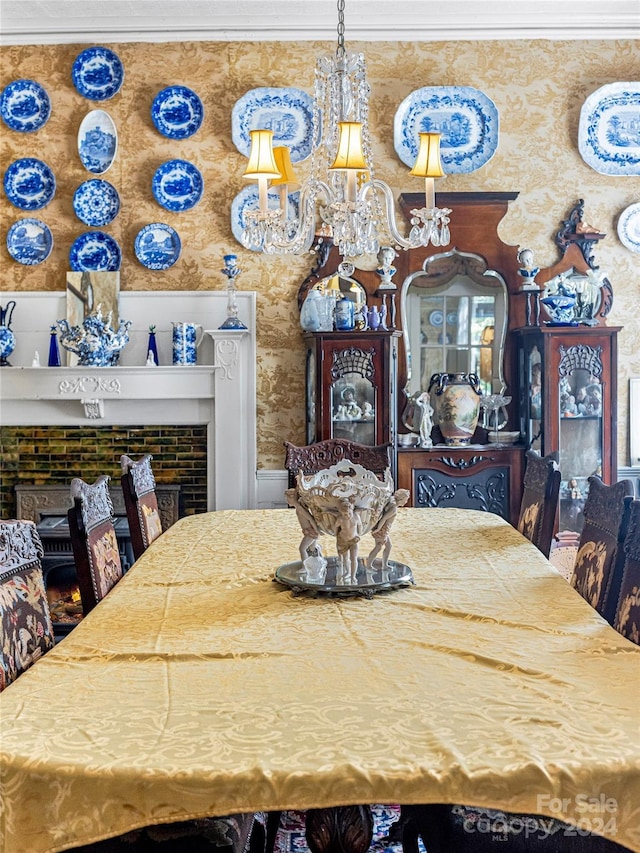 dining area with ornamental molding and a notable chandelier