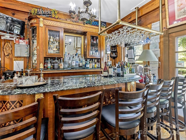 bar with dark stone countertops