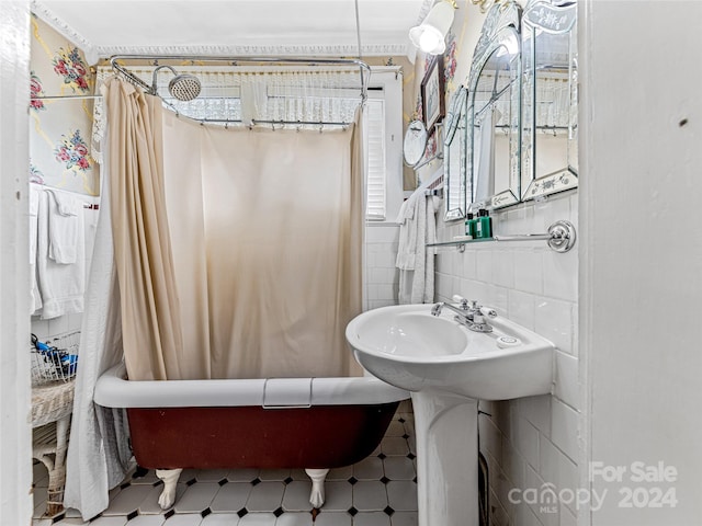 bathroom featuring shower / tub combo with curtain and tile walls