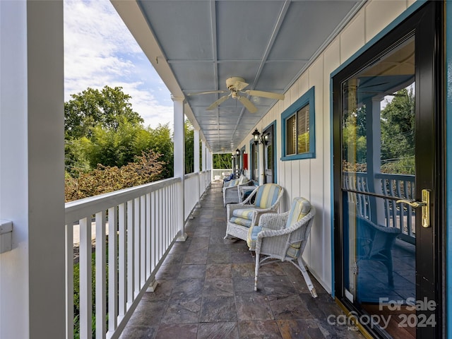 balcony featuring covered porch and ceiling fan