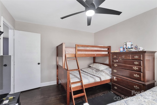 bedroom featuring ceiling fan and dark wood-type flooring