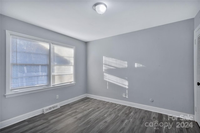 empty room featuring dark hardwood / wood-style floors