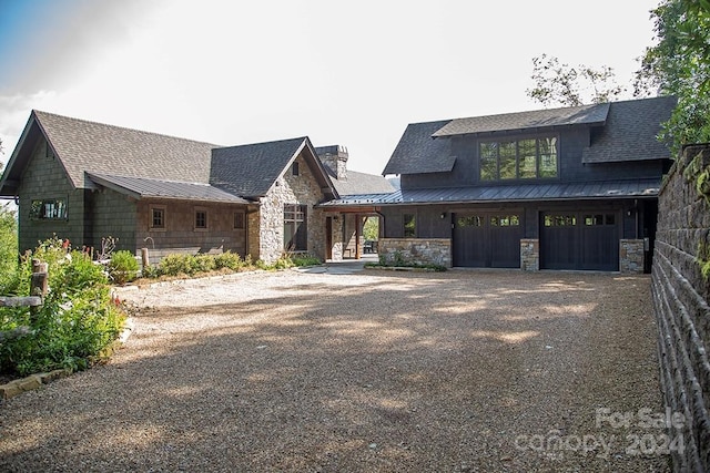 view of front of property featuring a garage and covered porch