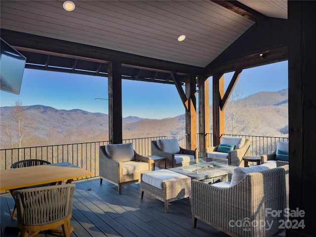 deck featuring a gazebo and a mountain view