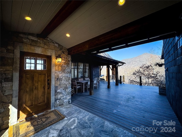 wooden terrace featuring a mountain view