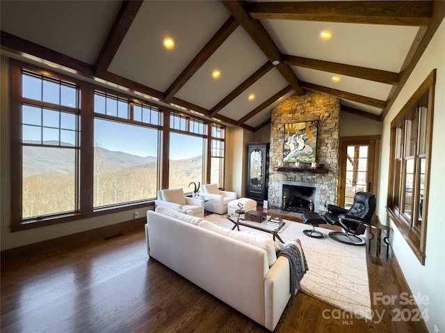 living room featuring a mountain view, high vaulted ceiling, dark hardwood / wood-style floors, a fireplace, and beam ceiling