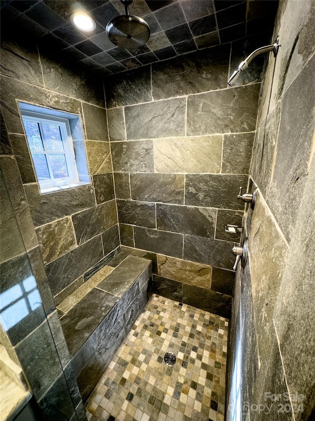 bathroom featuring tiled shower