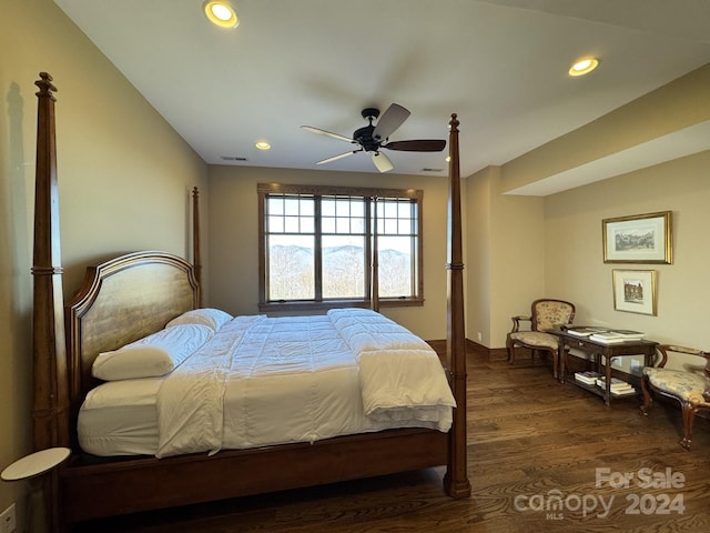 bedroom with ceiling fan and dark hardwood / wood-style flooring