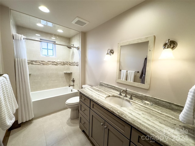 full bathroom with tile patterned floors, vanity, toilet, and shower / tub combo with curtain