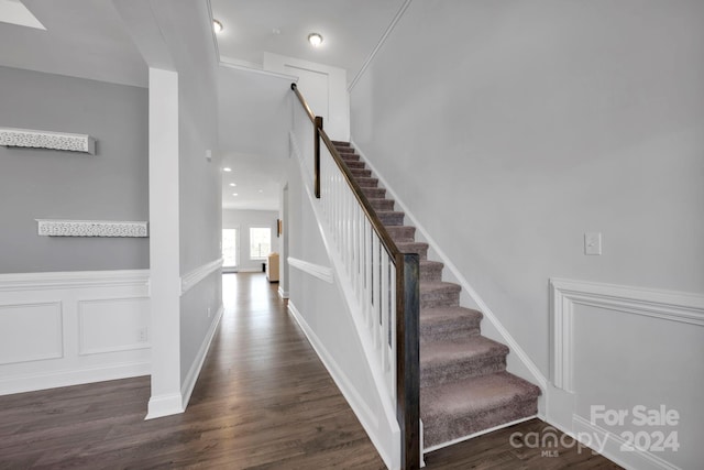 stairs featuring wood-type flooring