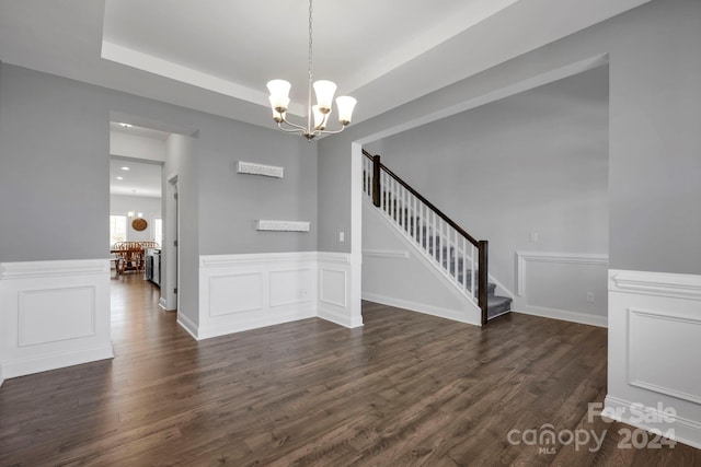 interior space featuring a notable chandelier and dark hardwood / wood-style floors