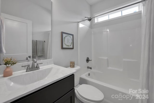 full bathroom with vanity, shower / bathtub combination with curtain, and toilet