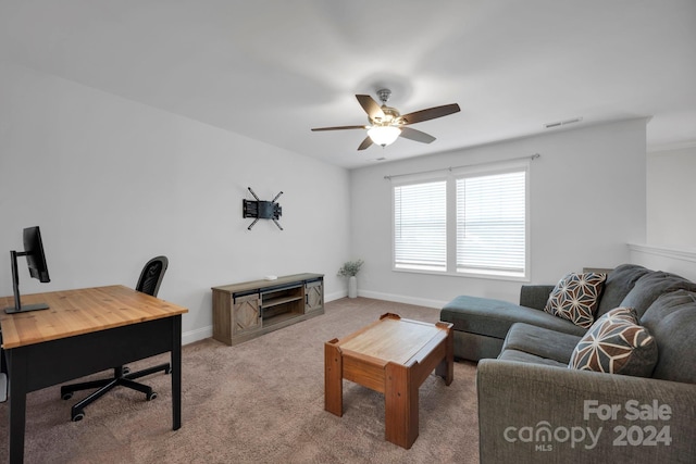 carpeted living room featuring ceiling fan