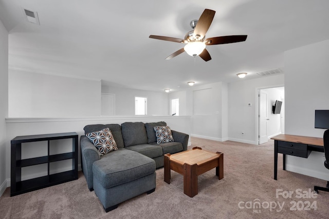 living room with light carpet and ceiling fan