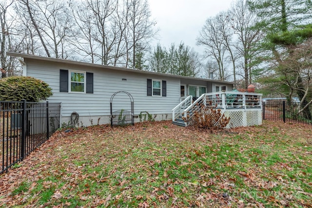 rear view of house with a deck