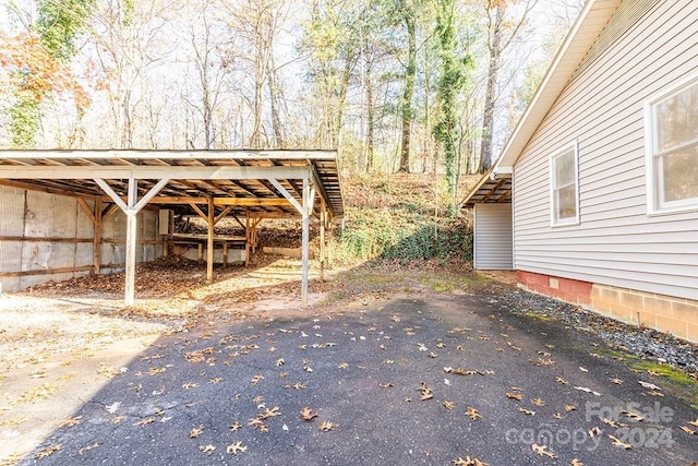 exterior space with a carport