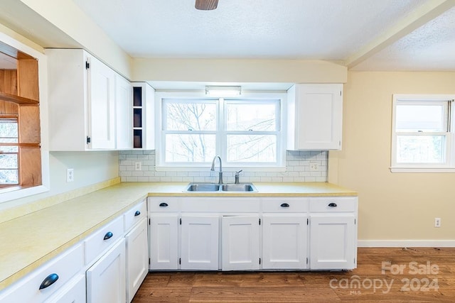 kitchen featuring white cabinetry, plenty of natural light, and dark hardwood / wood-style floors